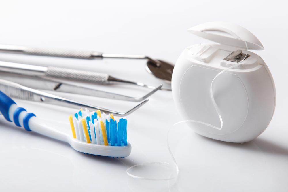 Close up of dental tools floss and toothbrush